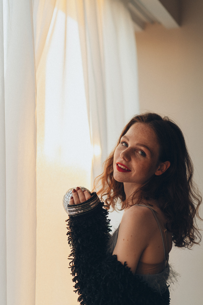 Smiling Woman by the Window